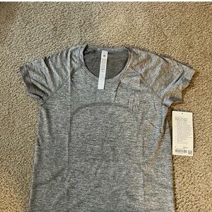 Brand new with tags Lululemom Swiftly tech tee in race length. Size 8